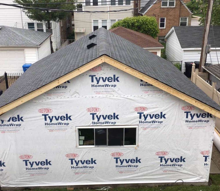 Roof and siding installation on garage